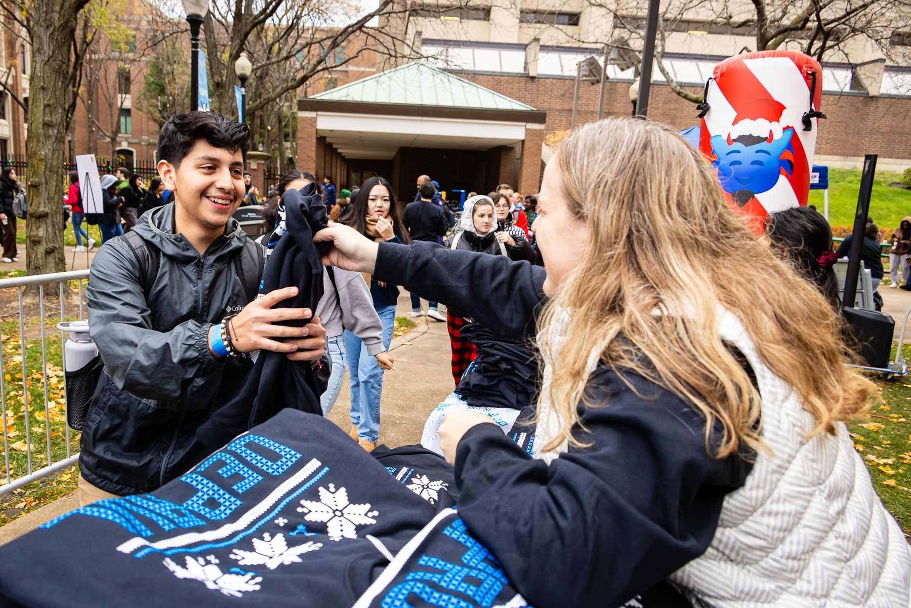 DePaul's famous ugly sweater is highly coveted among students, with some students waiting more than 6 hours prior to opening. (Photo by Jeff Carrion / DePaul University) 